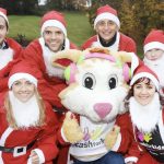 On the starting line at the Santa Dash Belfast City 2018 Ed McGinley, Content Manager for GRAHAM (event sponsors) and former Irish international athlete; David O’Flaherty, Maintenance Estimator for GRAHAM Facilities Management and a member of the award-winning Northern Ireland and Ulster Senior 2016 Cross Country Championship Team; Gordon Richardson, Senior Contracts Manager, GRAHAM; Jacqueline Liddell, GRAHAM Energy Technician; and (Front Row) Kerry O'Flaherty, who represented Ireland in the 3,000m steeplechase at the Olympic Games in Rio; Courage, Cash for Kids Mascot; and Therese Wilson, Charity Executive, Cash for Kids.