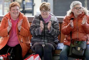 A number of shoppers enjoy the entertainment at the Harmony Hub during a break from their Christmas shopping.