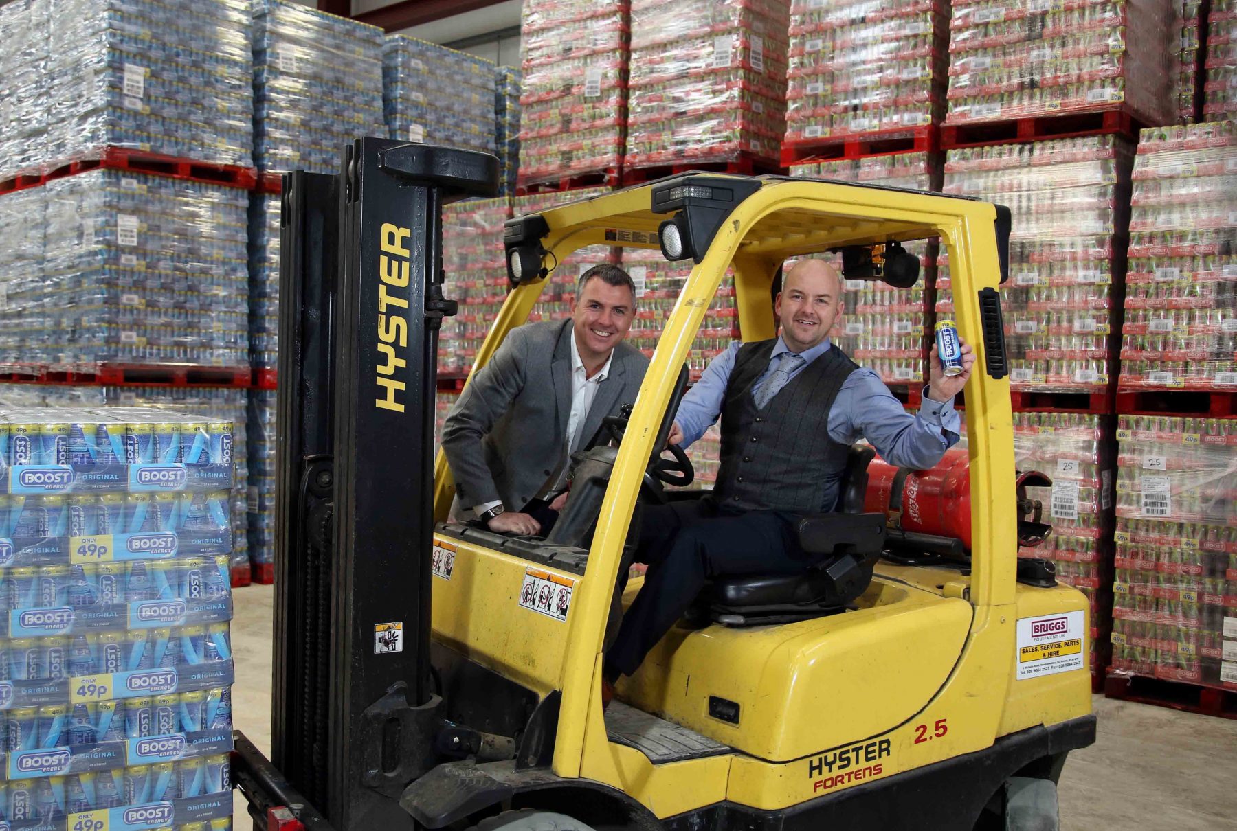 Boost Energy founder and Managing Director Simon Gray (left) celebrates a record year for the drinks company in Northern Ireland with Gareth Hardy, Managing Director of County Antrim-based Hardy Sales and Marketing Ltd (HSMNI).