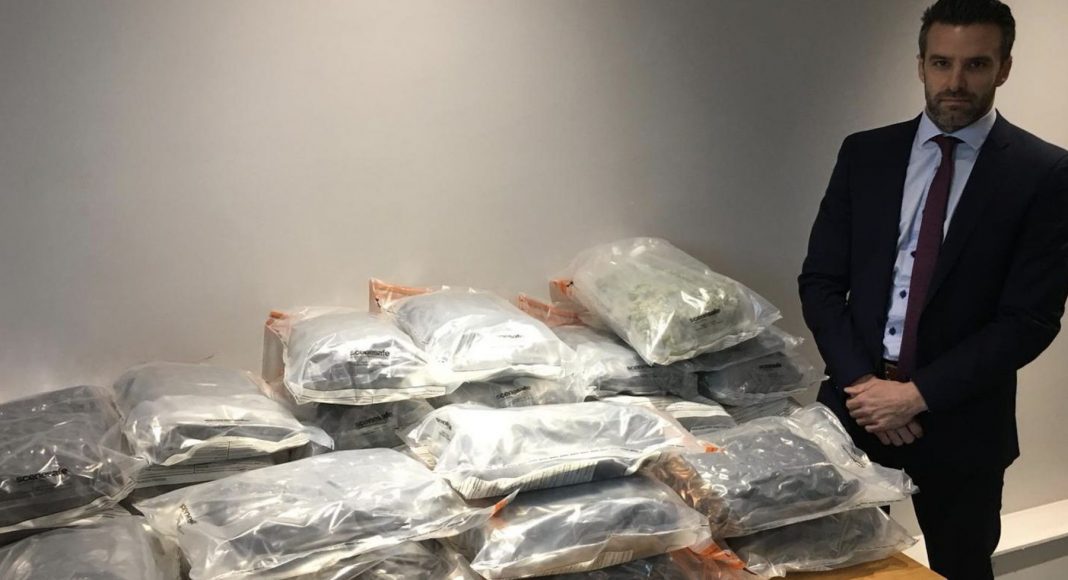 Detective Superintendent Bobby Singleton with approximately 50kg of herbal cannabis with an estimated street value of just under £1million following a proactive operation in Belfast yesterday