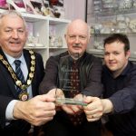 The shoe fits for Pattersons Chair of Mid Ulster District Council, Councillor Sean McPeake is pictured with Nigel and Scott Patterson from Pattersons Shoes Dungannon and their Rainbow Club Irish Retailer of the Year award.