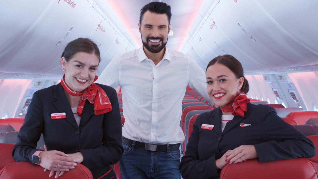 Celebrity presenter Rylan Clark-Neal (centre) is joined by Jet2holidays cabin crew to launch a new competition