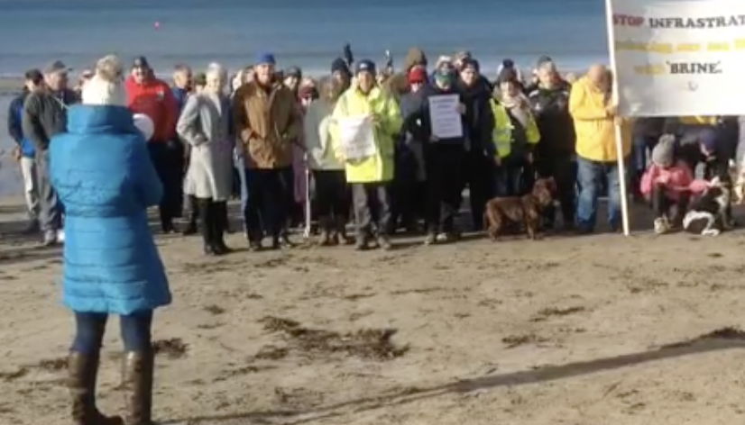 Crowds gather to protest over gas cavern plans.