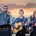 Tuning up for the return of Midtown Sounds Pictured is Joe Rocks from Mid and East Antrim Borough Council with Dean McKay, one of the many acts performing at the event, alongside Kathleen McBride, Ballymena BID Manager.