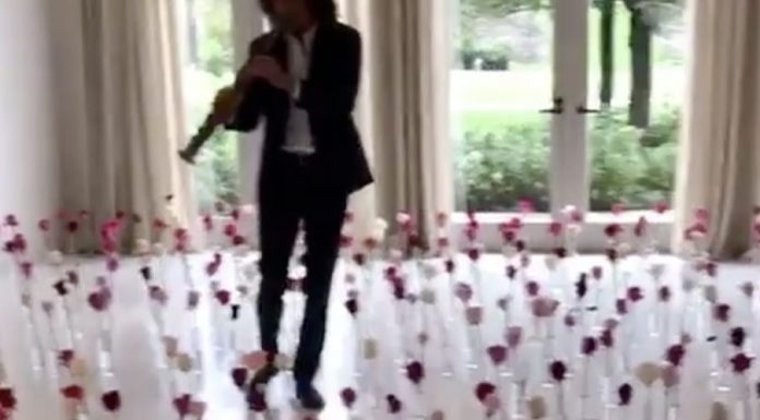 Tiptoe through the tulips…how exactly does Kenny G escape? Kenny G and the room full of roses.