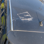 Breeze block damages police vehicle after being thrown from high rise flat in New Lodge